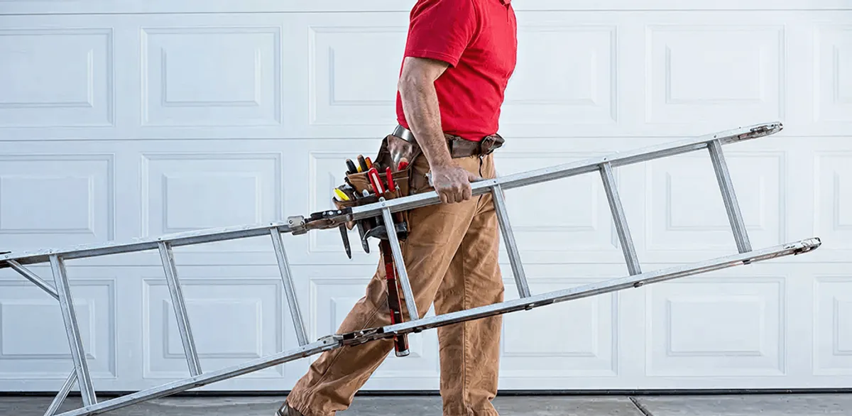 Garage door repair technician arriving with tools and ladder in Reno, NV