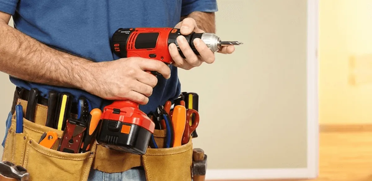 Handyman holding a power drill for home repairs and installations in Reno, NV